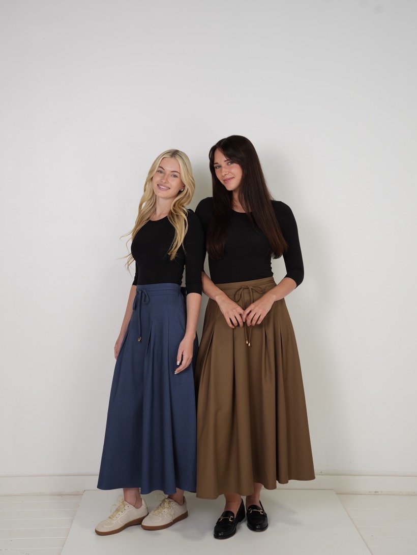 Two models in blue and camel maxis